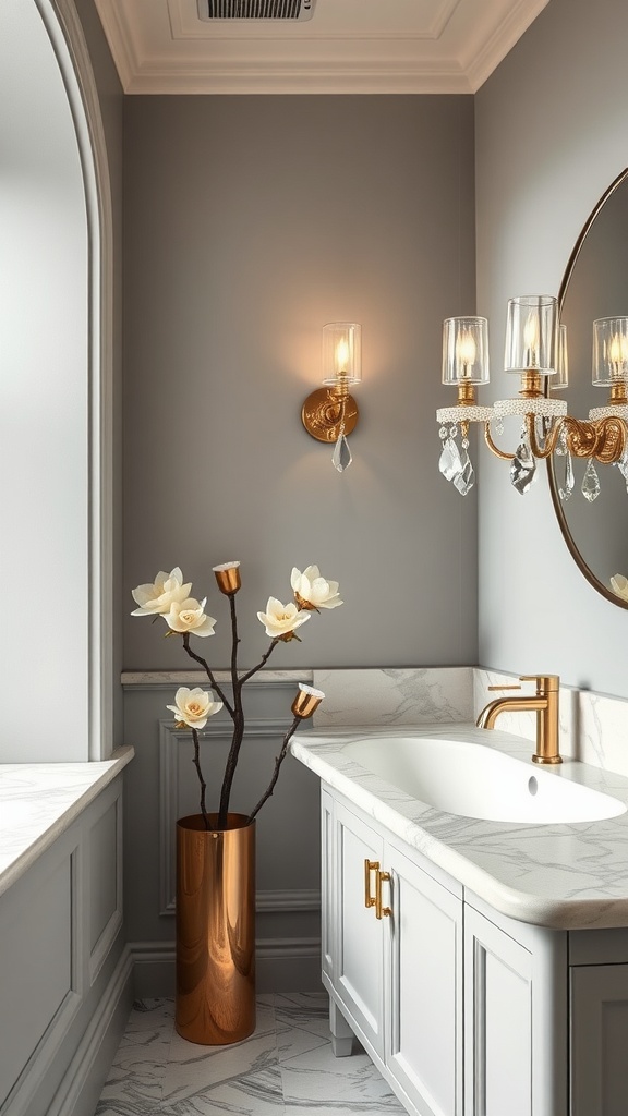 A stylish bathroom featuring elegant crystal wall lights, a marble countertop, and a floral arrangement in a copper vase.