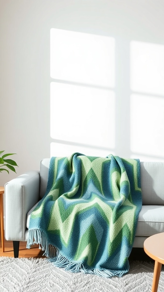 A geometric blue and green throw blanket draped over a light-colored couch in a living room setting.